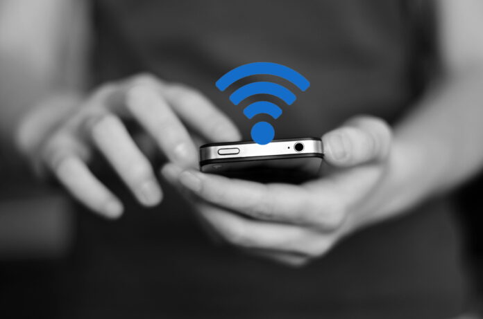 Person holding smart phone in hands to communicate and text