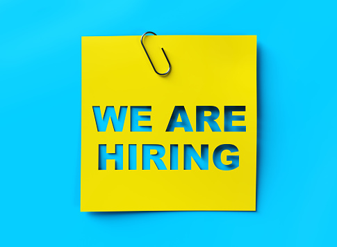 "We are hiring" yellow banner on blue textured background