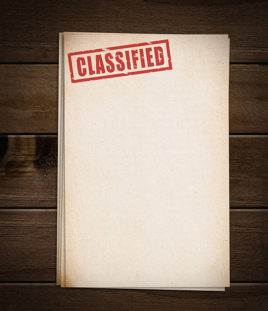 Block of old papers with classified stamp.