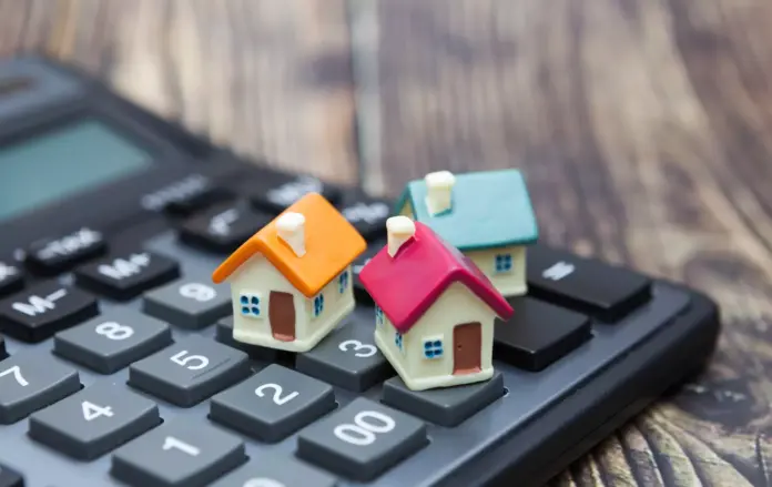buy-home-house-is-placed-on-the-calculator-